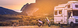 motorcycle and rv near mountains