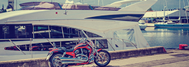 motorcycle in front of a boat